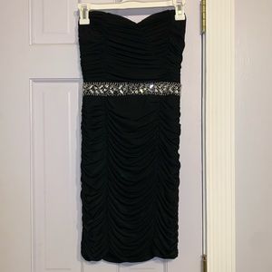 Small black ruched mini strapless dress